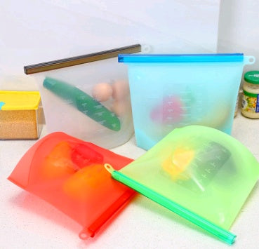 Shopi Vella silicone food storage bag set in multiple colors holding vegetables and eggs on kitchen counter