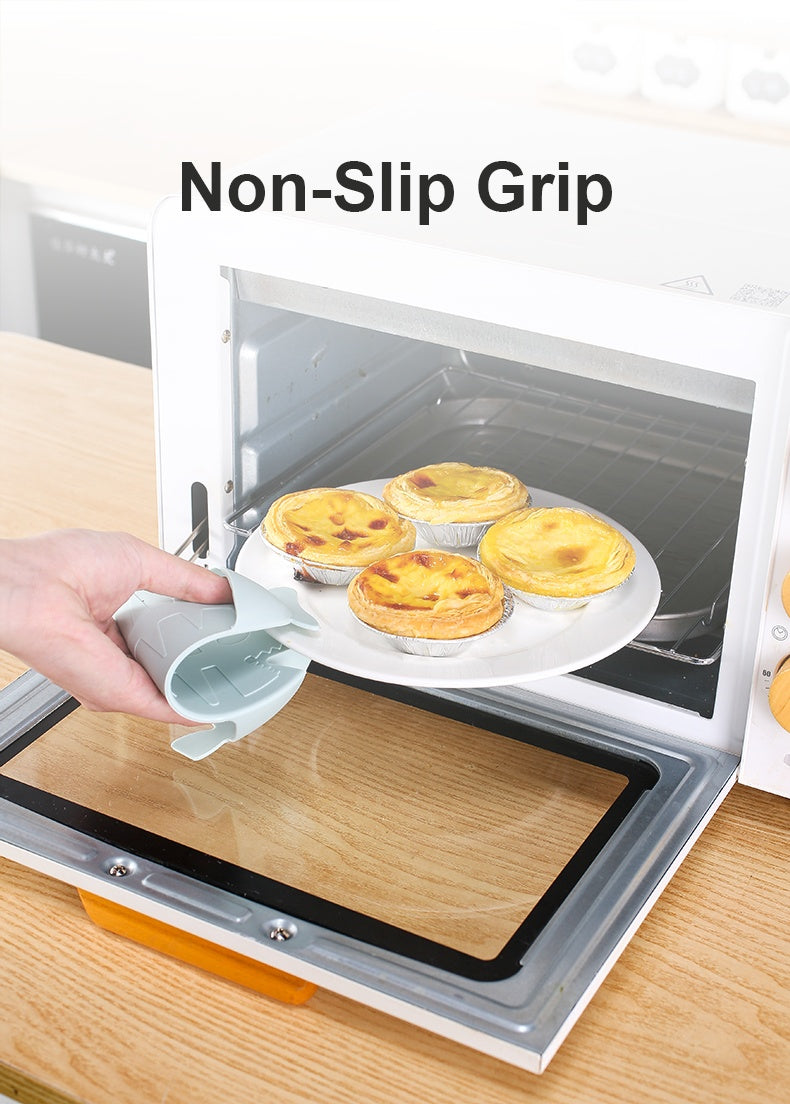 Non-slip grip silicone floor drain with hair catcher being used to hold a plate of baked goods near an oven