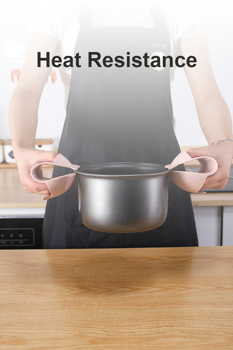 Person holding pot with silicone heat-resistant grips demonstrating silicone floor drain with hair catcher feature