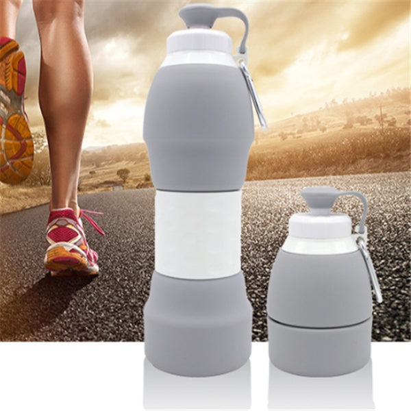 Gray silicone folding water bottle by Shopi Vella shown expanded and collapsed for portable hydration