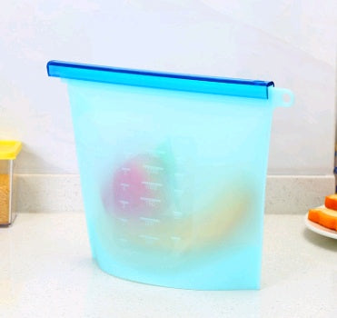 Shopi Vella blue silicone food storage bag on kitchen counter with fruits inside