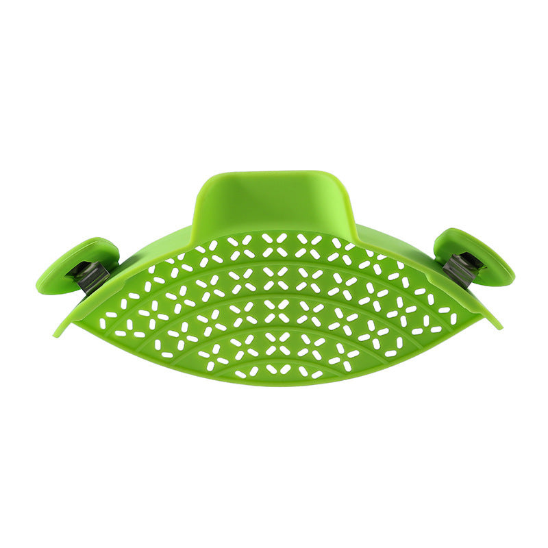 Shopi Vella green silicone pot side drain stopper with perforated design for kitchen storage