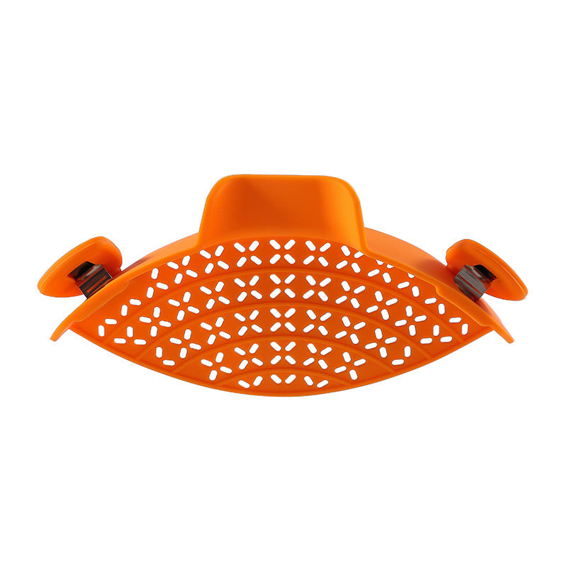 Shopi Vella orange silicone pot side drain stopper with perforated design for kitchen storage