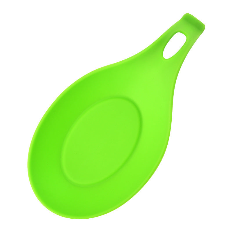 Bright green silicone spoon rest for kitchen with handle hole for easy hanging and cleaning