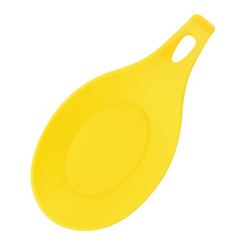 Yellow silicone spoon rest for kitchen with handle and hole for hanging