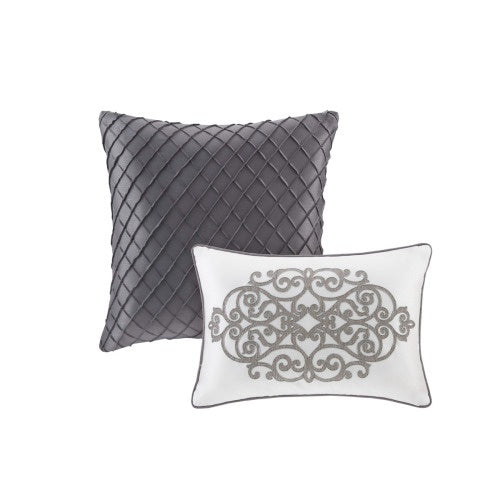 Decorative pillows included in the silver comforter set king with embroidered and quilted designs