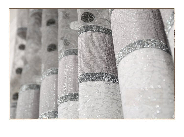 Close-up of Shopi Vella comforter fabric resembling simple blackout curtains with textured and glittery patterns