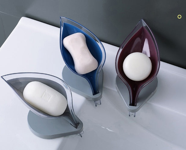 Shopi Vella sink sponge drain box in blue, purple, and gray colors holding soap bars on bathroom sink