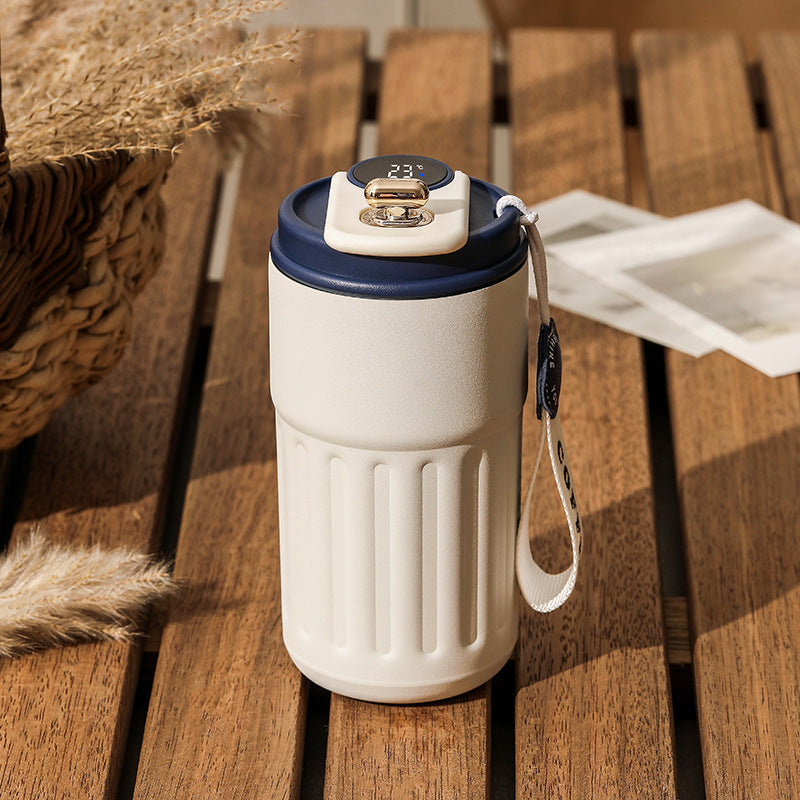 Shopi Vella smart thermal coffee mug in white with digital temperature display and carrying strap