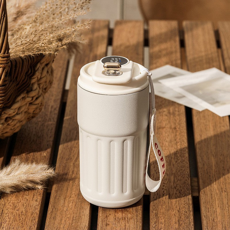 Shopi Vella smart thermal coffee mug in white with digital temperature display and carry strap