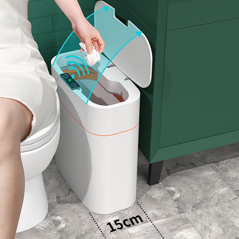Shopi Vella smart trash can with lid in white placed in bathroom near green cabinet and toilet