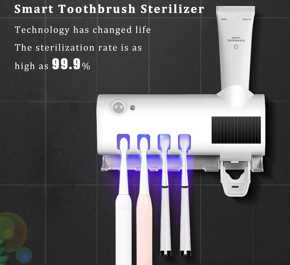 Smart UV toothbrush sterilizer mounted on wall with four toothbrushes and toothpaste dispenser
