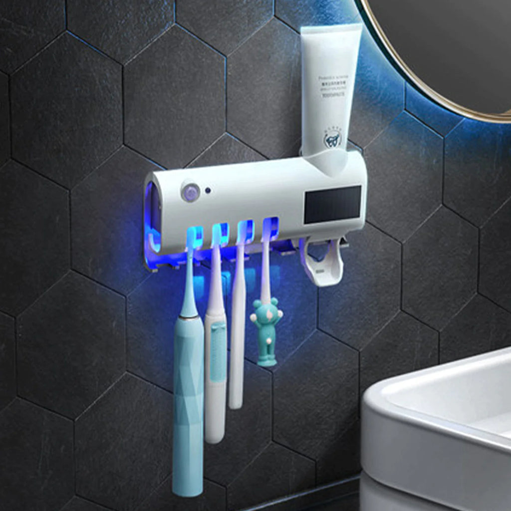 Smart UV toothbrush sterilizer mounted on black hexagon tile wall with multiple toothbrushes and toothpaste