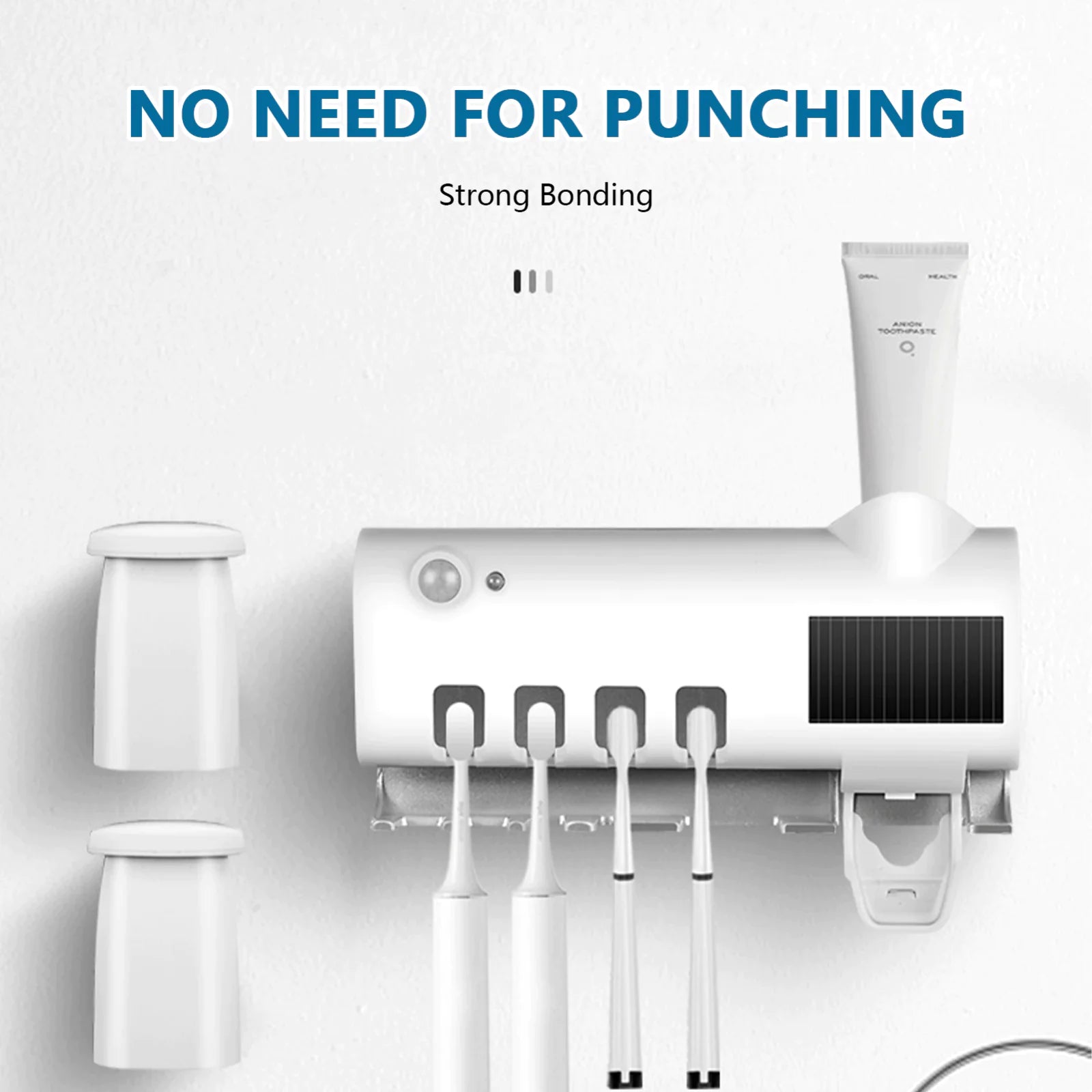 White smart UV toothbrush sterilizer mounted on wall holding four toothbrushes and toothpaste