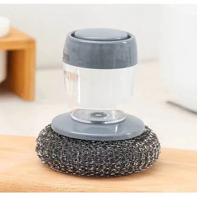 Shopi Vella soap dispensing kitchen brush with gray handle and attached steel scrubber for cleaning