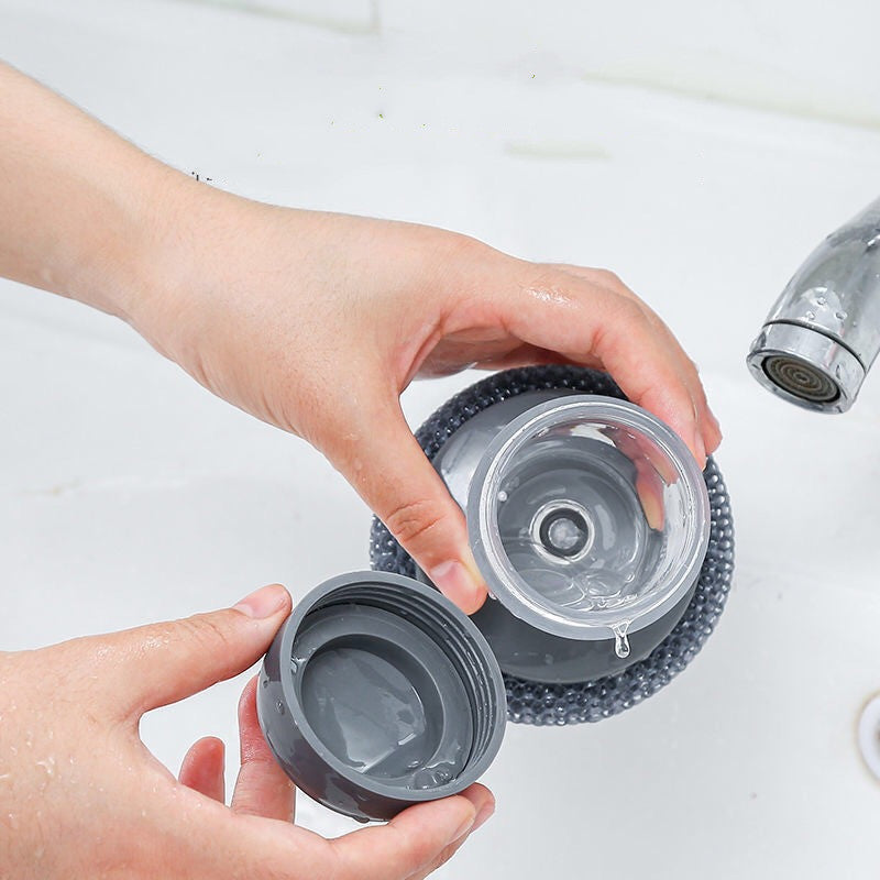 Shopi Vella soap dispensing kitchen brush being refilled with liquid soap over a sink