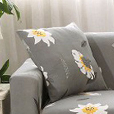 Gray sofa cushion cover floral print with white and yellow flowers on couch armrest