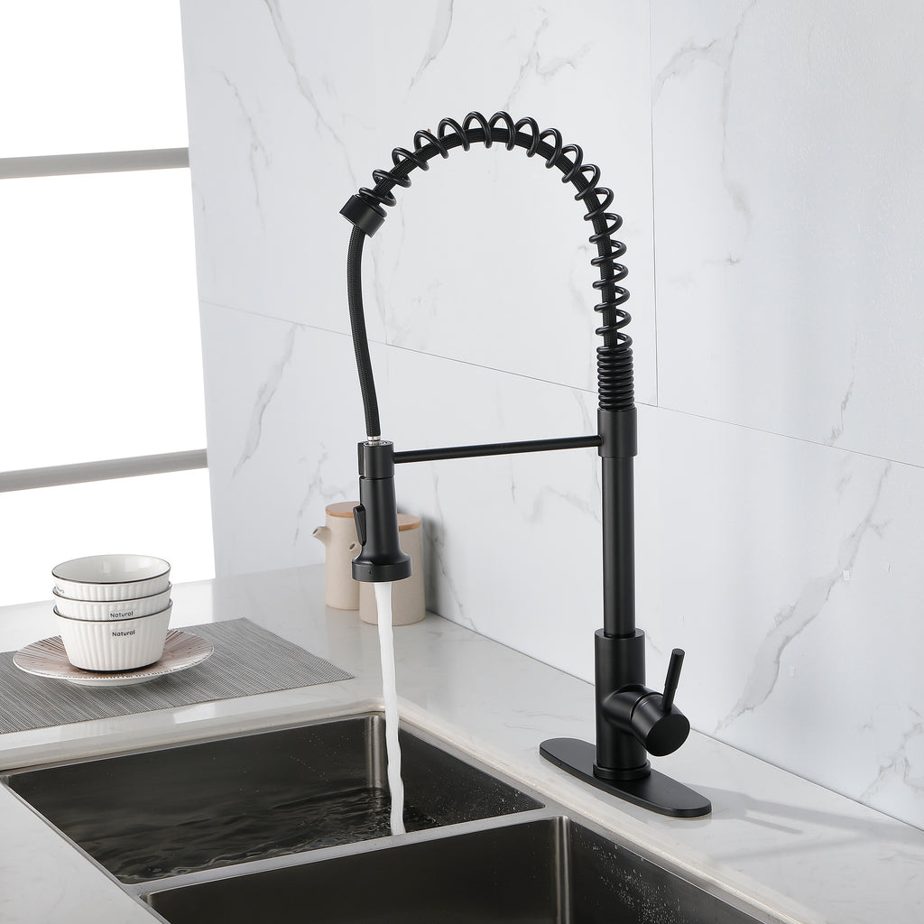 Matte black solid brass kitchen faucet with spring coil design installed on stainless steel sink