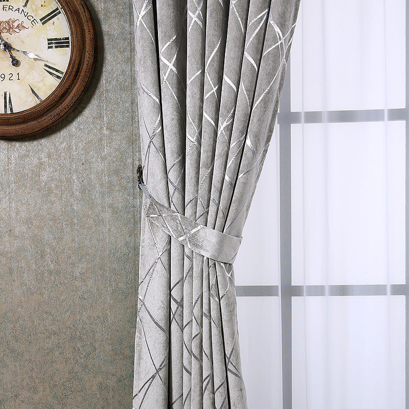 Shopi Vella solid color living room curtains in gray with geometric pattern tied back near a window
