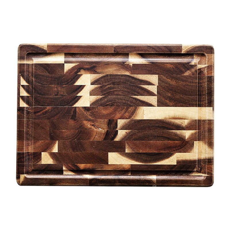 Shopi Vella rectangular solid wood cutting board with mixed wood grain pattern and juice groove