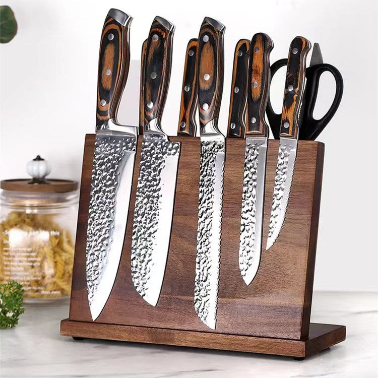 Shopi Vella solid wood magnetic knife holder with six knives and kitchen scissors on a marble countertop