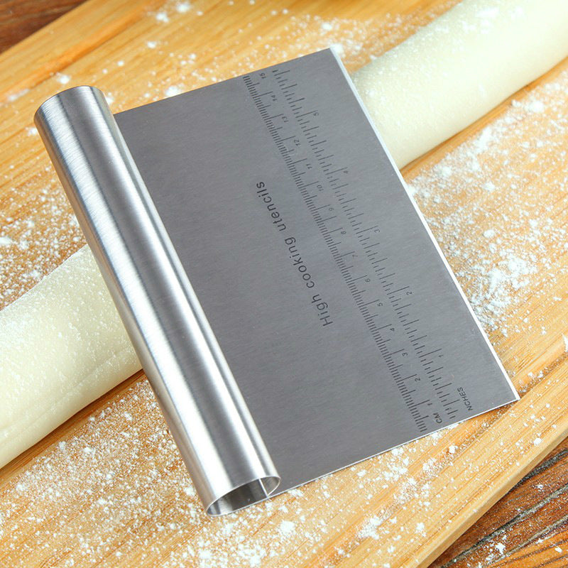 Shopi Vella stainless steel pizza dough cutter tool with ruler on wooden board with dough