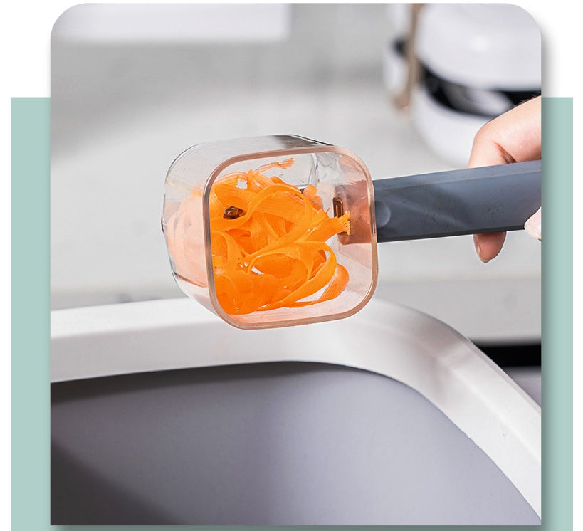 Shopi Vella stainless steel vegetable peeler with built-in container holding fresh carrot peelings