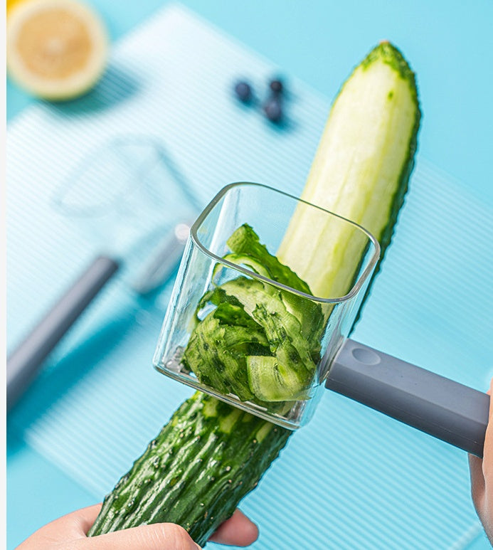 Shopi Vella stainless steel vegetable peeler peeling cucumber with easy grip handle
