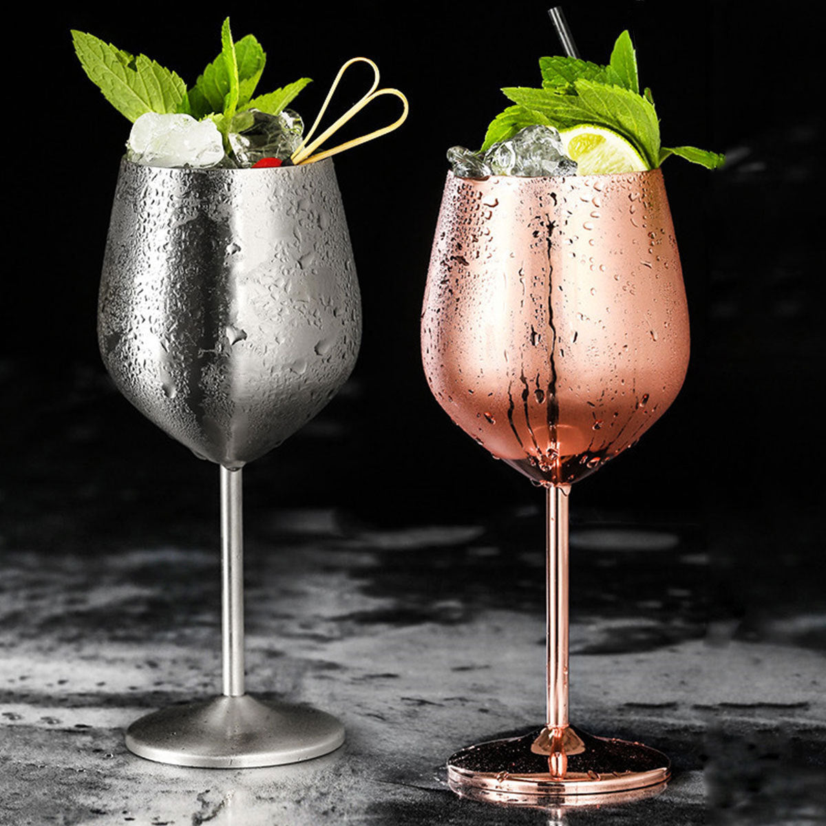 Shopi Vella stainless steel wine glass set in silver and rose gold with ice and mint garnish