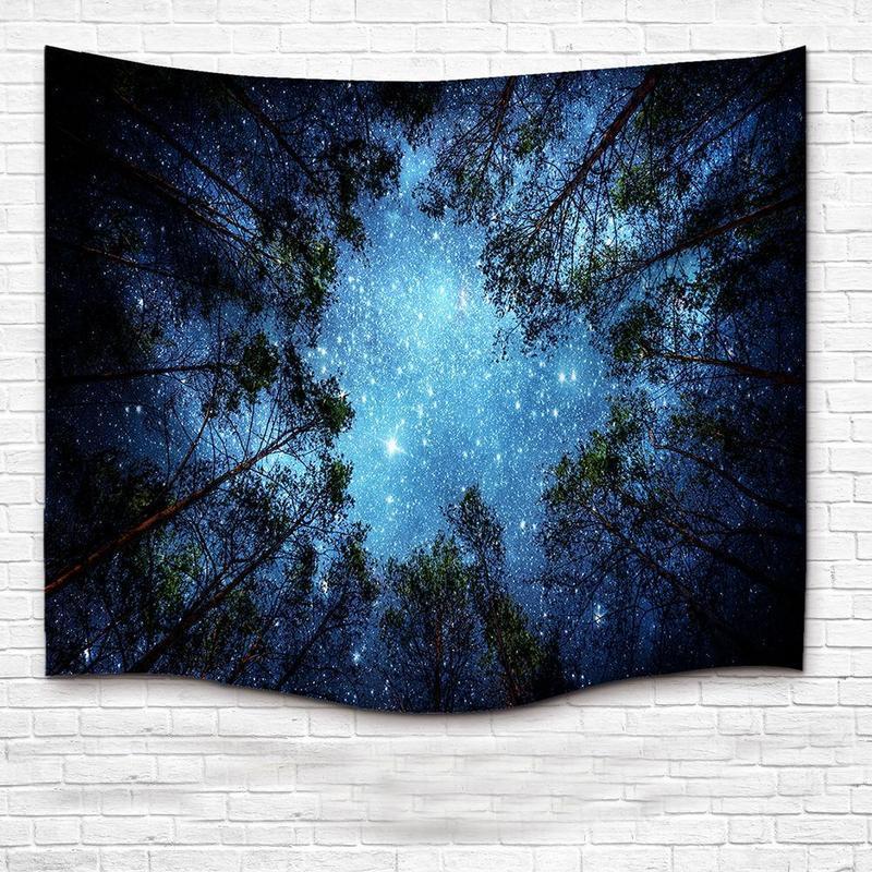 Shopi Vella starry forest tapestry wall hanging showing a night sky filled with stars above tall trees