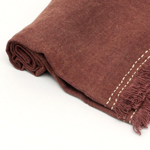 Shopi Vella stonewashed linen throw blanket in brown with stitched details and fringed edges