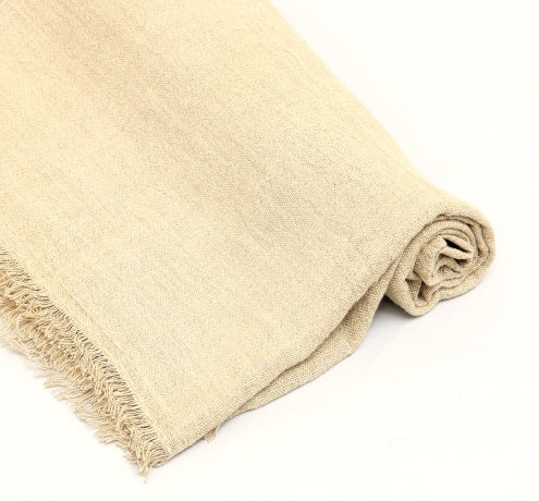 Shopi Vella stonewashed linen throw blanket in beige with soft texture and fringed edges