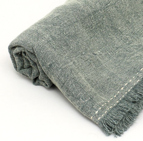 Shopi Vella stonewashed linen throw blanket in gray with textured fabric and fringed edges