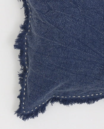 Shopi Vella stonewashed linen throw pillow case in navy blue with frayed edges and decorative stitching