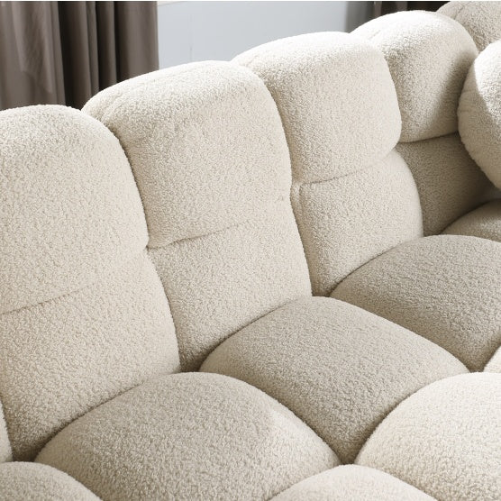 Close-up of beige textured fabric on a stylish apartment sofa with plush cushioned seats