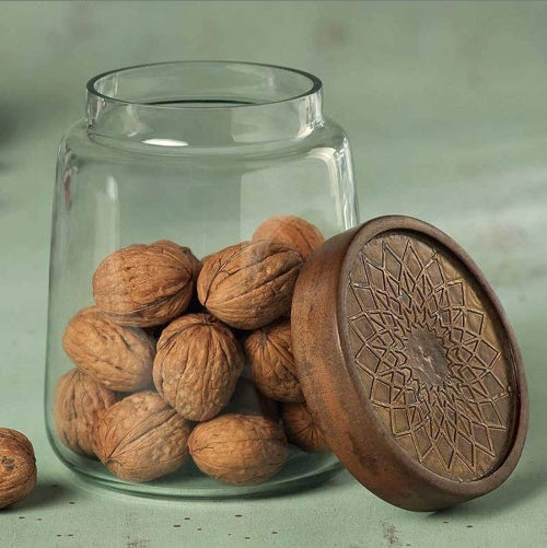 Shopi Vella stylish glass jar food storage with wooden patterned lid holding whole walnuts