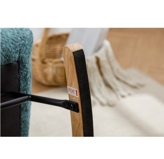 Close-up view of stylish lounge chair for home office wooden armrest and blue upholstery
