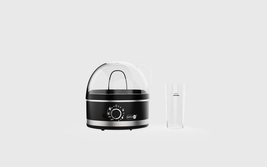 Shopi Vella portable steam appliance for cleaning with black and silver design and clear water container