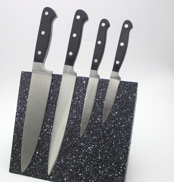 Shopi Vella knives set displayed on a speckled tool storage rack organizer with black handles