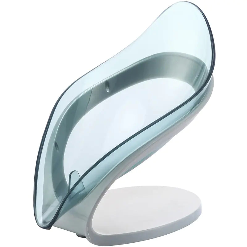 Transparent leaf soap holder with modern curved design and sturdy white base for bathroom use