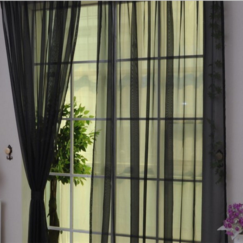 Shopi Vella transparent tulle window curtains in black sheer fabric hanging on a window