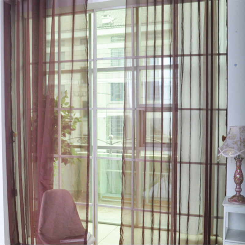 Shopi Vella transparent tulle window curtains in a living room with chair and lamp