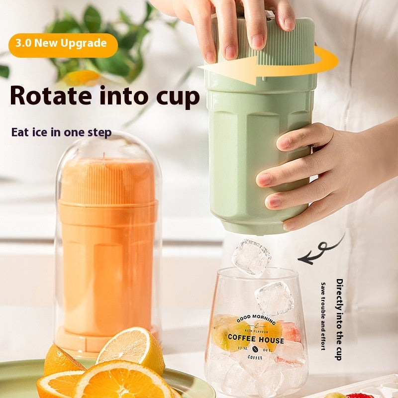 Shopi Vella twisting ice cup mold for freezer in green with ice cubes dropping into glass cup