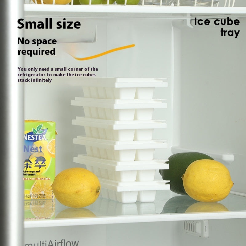 Twisting ice cup mold for freezer stacked in a refrigerator next to lemons and juice carton by Shopi Vella