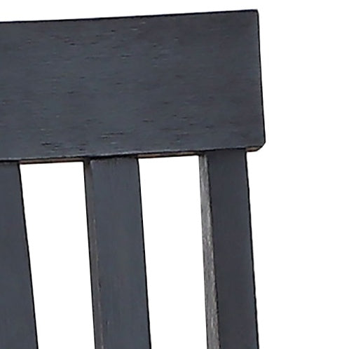Close-up of black wooden chair backrest from Shopi Vella two tone cottage dining table set