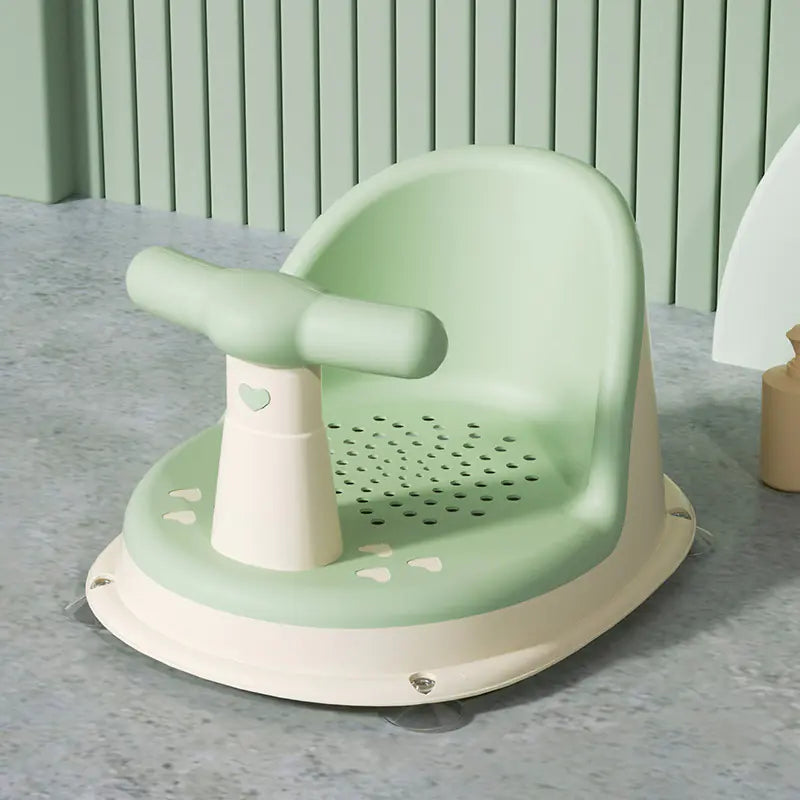 Green and white universal baby bath seat with safety handle and drainage holes for infant bathing