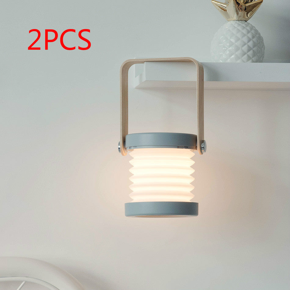 USB rechargeable lantern for home decor hanging with soft light and wooden handle in a modern room