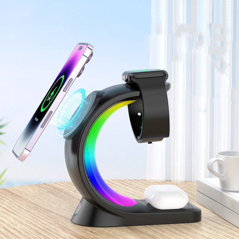 Shopi Vella 4 in 1 magnetic wireless charger with black stand charging phone smartwatch and earbuds on wooden table