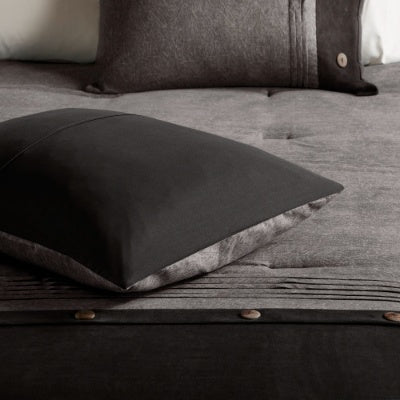 Shopi Vella 7 piece faux suede comforter set featuring dark gray and black tones with button details