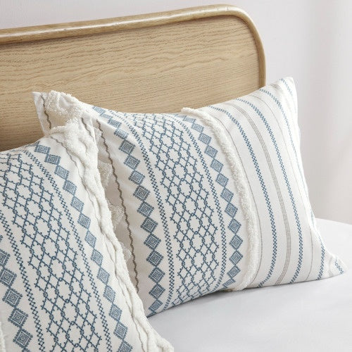Shopi Vella cal king chenille duvet set with blue geometric patterns on white pillows
